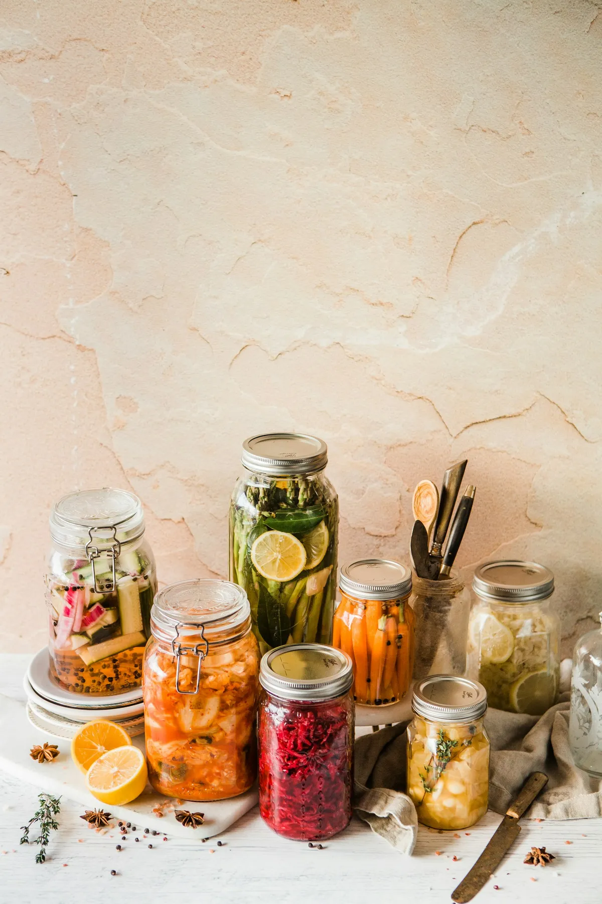 Assorted jars of fermented foods representing the range of probiotics and postbiotics fermentation can produce